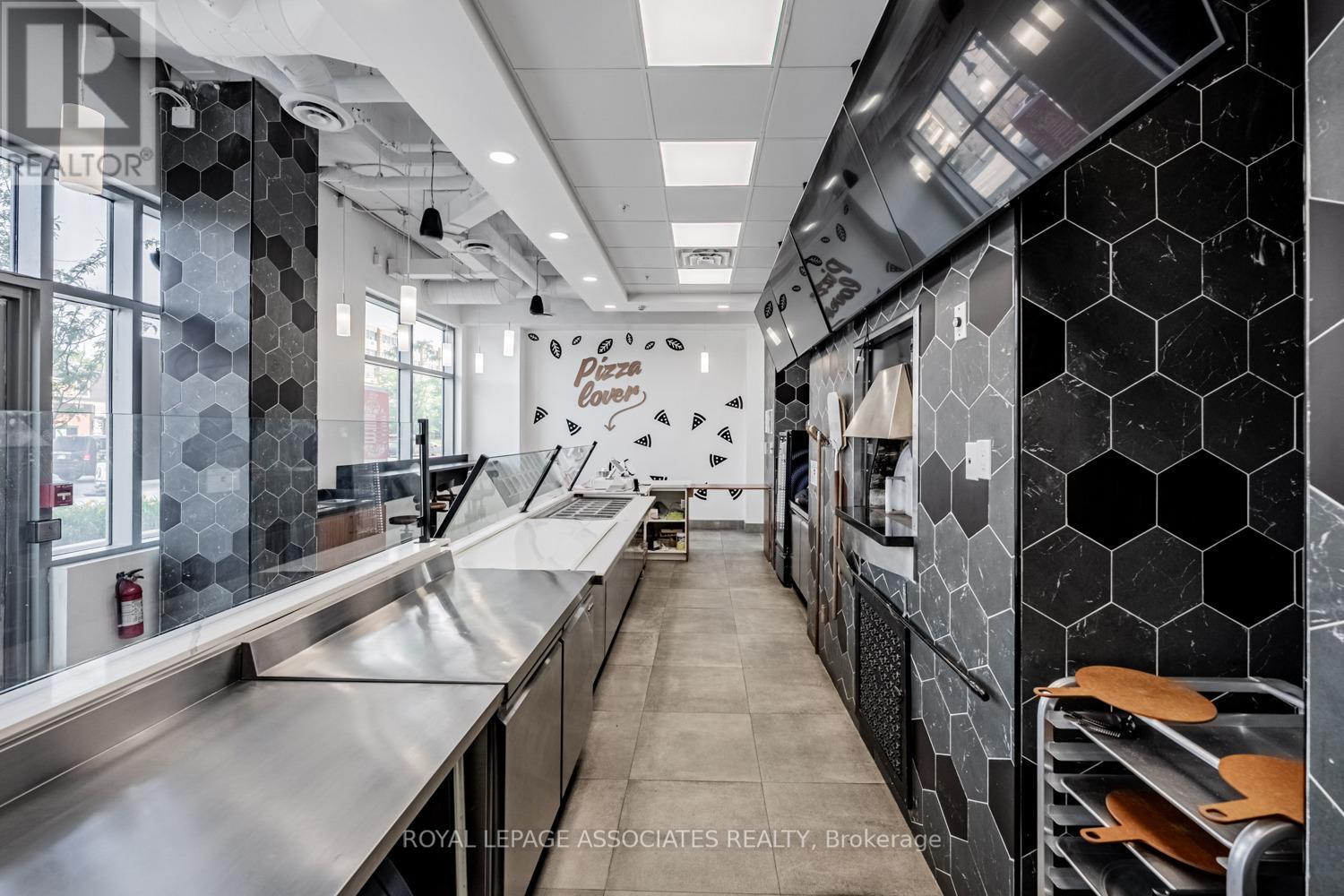 B – 205 QUEEN STREET E
